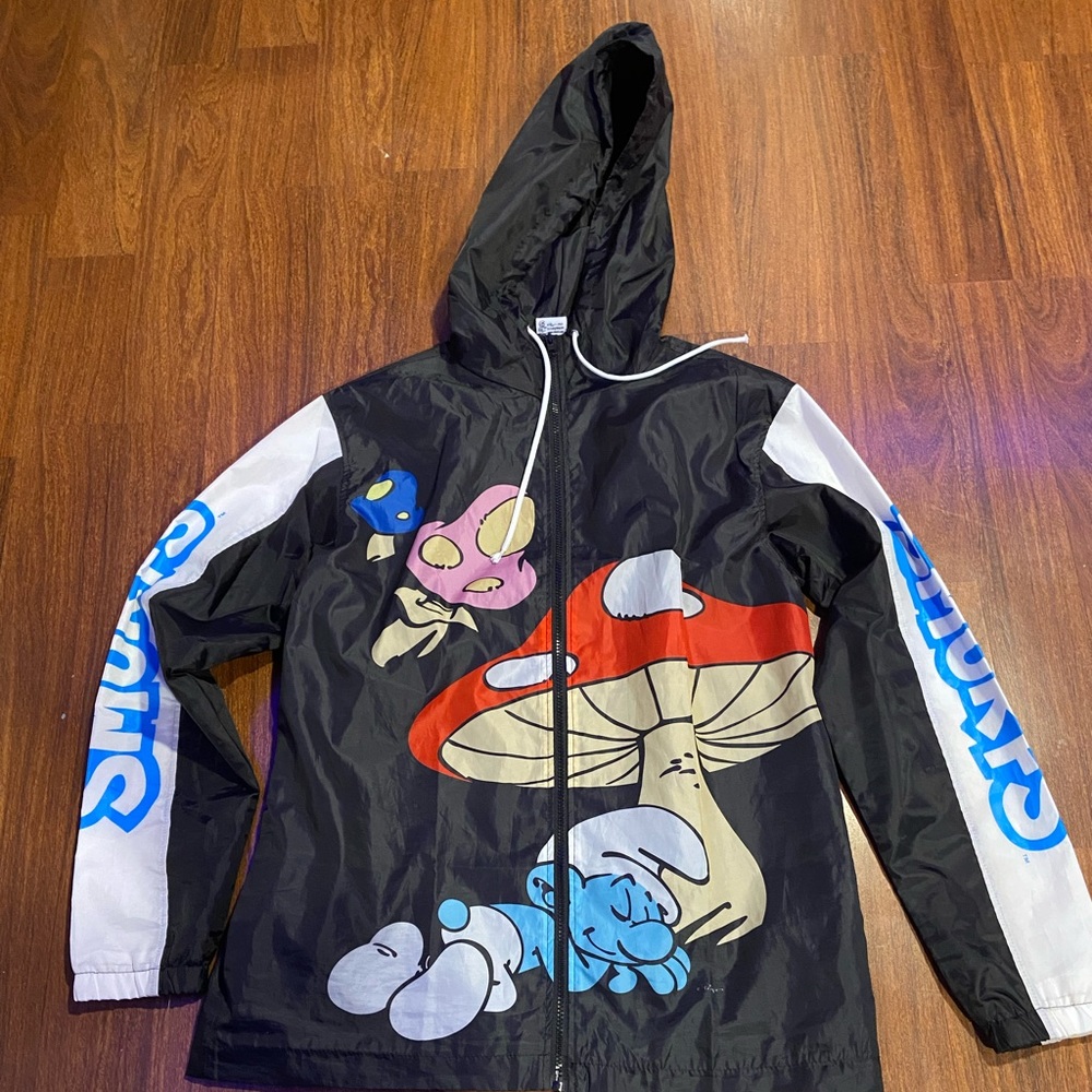 From rue 21, Worn twice, size medium, design Smurfs, windbreaker.